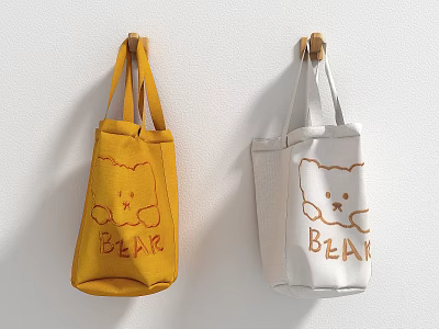 Yellow And White Canvas Bags Featuring Cute Bear Design And BEAR Text Hanging On Wall 3d model
