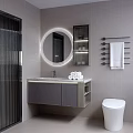 Modern Bathroom Vanity With Round Backlit Mirror Gray Cabinet And Rolled Towels