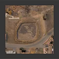 Aerial View Landscape With Circular Dirt Pit Surrounding Road Grassland And Small Buildings