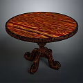 Vintage Round Wooden Table With Intricate Carved Legs And Natural Wood Grain Top