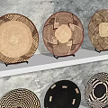 Woven Decorative Ornament Set On Three Tiered Wall Shelves With Diverse Patterns