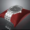 Elegant Silver Wristwatch on Red Cushion with Metal Strap and Classic Dial Design