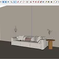 Beige Sofa Set with Plush Pillows Floor Lamp and Side Table Potted Plant