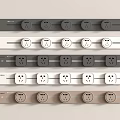 Neatly Arranged Electrical Socket Panels In Different Colors With Multiple Outlets