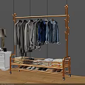 Golden Metal Clothing Rack With Hanging Shirts Jeans Folded Clothes And Shoes In Bedroom