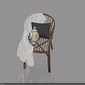 Wicker Chair With White Blanket And Pillows Featuring Reflection On Light Blue Background