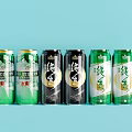 Various Canned Drinks with Different Colors and Chinese Labels on Light Blue Background