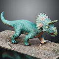 Teal Triceratops Dinosaur Model Featuring Pink Frill Standing On Rocky Base Design