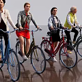 Women Riding Different Colored Bicycles Together in Stylish Casual Outdoor Wear