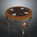 Classical Wooden Round Table with Intricate Carved Legs and Decorative Floral Patterns on Top