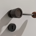 Modern Door Handle With Black Metal Base And Wooden Knob On White Wall