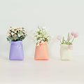 Colorful Decorative Vases Holding Pink Tulips White Flowers And Mixed Blooms On White Table