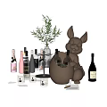 Wine Bottles and Wine Glasses Styled Display with Rabbit Sculpture Vase and Greenery