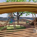 Park Landscape With Green Trees Pink Flowers Wooden Bridge Steps And Grassy Lawn