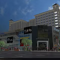 Vibrant Commercial Street With High Rise Buildings Storefronts Cars And Green Trees