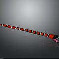 Red Black White Striped Snake With Tongue Sticking Out On Shiny Gray Surface