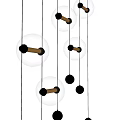 Three Illuminated Black Transparent Spherical Pendant Lights With Metal Rods And Small Metal Balls