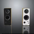 Modern Black And White Electronic Speakers With Gold Trim And Compact Design
