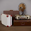 Vintage Suitcases Stacked Brown White Patterned With Retro Fan On Top
