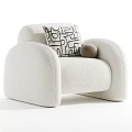 Modern Beige Single Sofa With Black And White Geometric Pillow And Brown Decorative Ball
