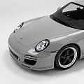 Silver Two Door Sports Car With Sleek Body And Black Wheels