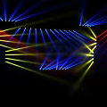 Colorful Stage Lighting Effects With Symmetric Geometric Patterns And Radiant Beams On Black Background