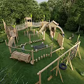 Kids Play Area With Wooden Climbing Frames Slides Swings And Green Grass