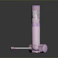 Three Pink Lip Gloss Tubes With Purple Rings And Applicator Brush
