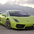 Green Lamborghini Sports Car Parked Outdoors With Mountainous Landscape Background