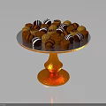Assorted Chocolate Candies on Golden Pedestal Stand with Striped and Round Toppings