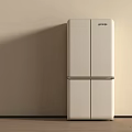 White Modern Refrigerator In Minimalist Setting With Light Wall And Wooden Floor