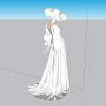 Woman In Long White Dress And Wide Brimmed White Hat Standing In Minimalist Setting