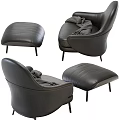 Luxurious Black Leather Accent Chair With Matching Ottoman And Wool Blanket