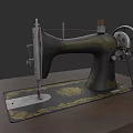 Antique Vintage Black Sewing Machine With Gold Patterns On Wooden Table
