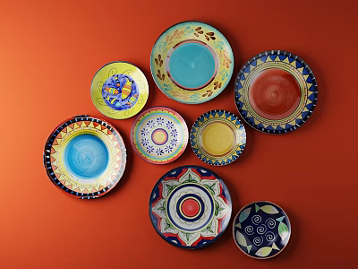 Multiple Vibrant Decorative Plates with Diverse Patterns on Orange Background for Interior Decor 3d model