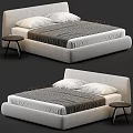 Modern Upholstered Double Bed With Gray Striped Quilt White Pillows And Small Round Side Tables