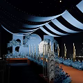 Elegant Banquet Hall Interior With Striped Ceiling Fairy Lights And Orange Carpet