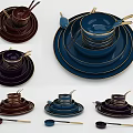 Elegant Multicolor Dinnerware Set with Stacked Plates Bowls and Gold Rim Spoons