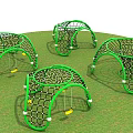 Green Arched Net Playground Equipment With Swings And White Support Balls On Grass