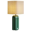Green Cylindrical Ceramic Table Lamp With Beige Fabric Shade And Soft Light