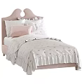 Cozy Single Beds with Pink Grey Headboards Dotted Quilt Striped Blanket and Ruffled Bedding