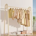 Stylish Living Room With Black Clothing Rack Light Colored Clothes Palm Plant And White Wall