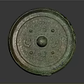 Ancient Bronze Mirror With Intricate Carvings And Circular Design Patina