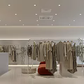 Stylish Clothing Store Interior Design With Displayed Clothes Clothing Racks And Plants