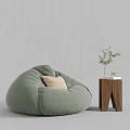 Light Green Bean Bag Chair with Wooden Side Table Green Plant and Books