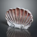 Decorative Scallop Shell Ornament With Red White Color And Spiral Base On Reflective Surface