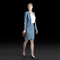 Elegant woman in blue suit with white blouse holding brown handbag against black background