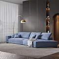 Blue Irregular Shaped Sofa In Modern Living Room With Floor Lamp And Gray Walls