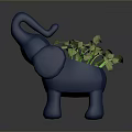 Green Leafy Plant in Blue Elephant Shaped Planter with Fresh Green Foliage
