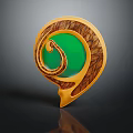 Artistic Jewelry Piece With Green Gemstone Gold Spiral And Intricate Carved Details